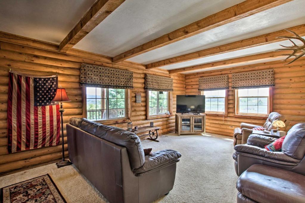 a living room with leather chairs and a television at Garden City Escape with View Less Than 2 Miles to Bear Lake in Garden City