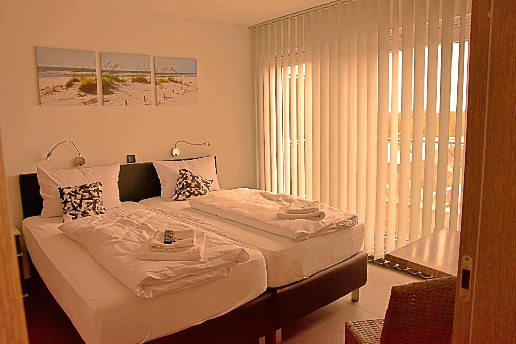 Postel nebo postele na pokoji v ubytování Hotel Walsroder Hof