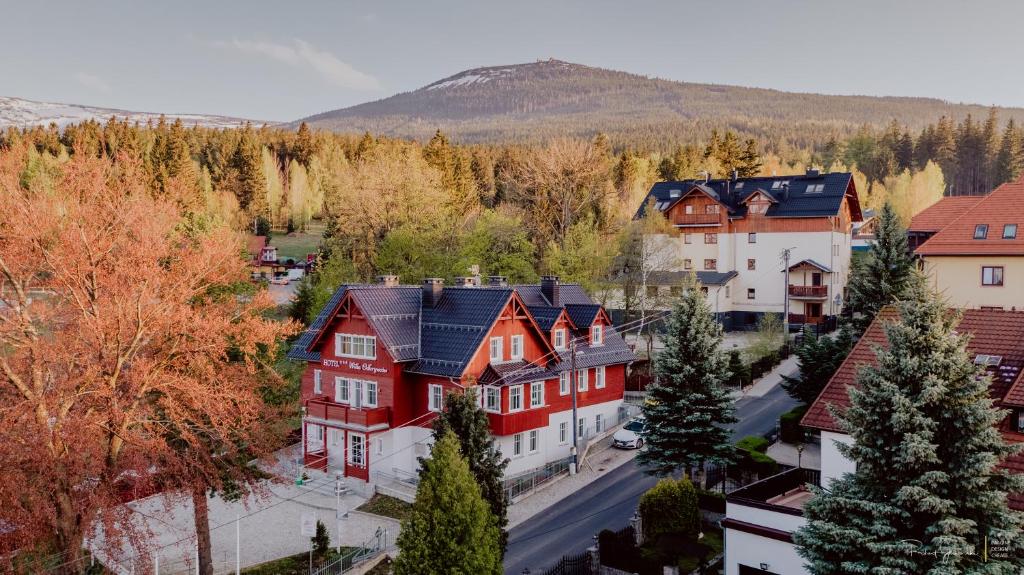 an aerial view of a town with a red house at Hotel Willa Odkrywców in Szklarska Poręba
