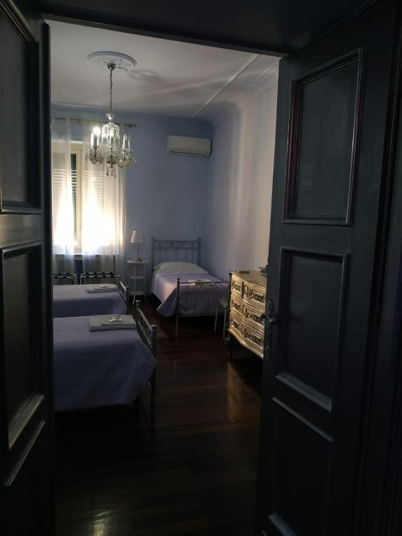 A bed or beds in a room at Around The Corner Colosseo B&B