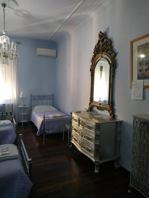 A bed or beds in a room at Around The Corner Colosseo B&B