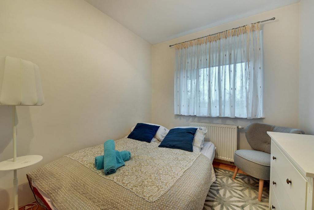 Posteľ alebo postele v izbe v ubytovaní Grand Apartments