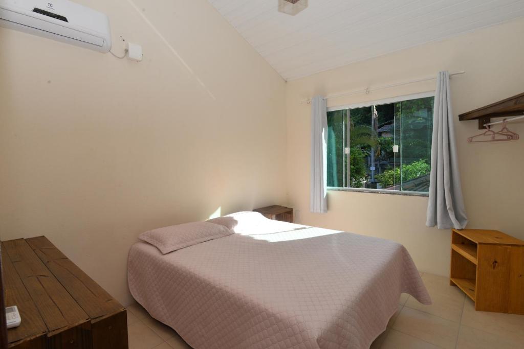 Cama ou camas em um quarto em Pousada Sítio Olho D'Água