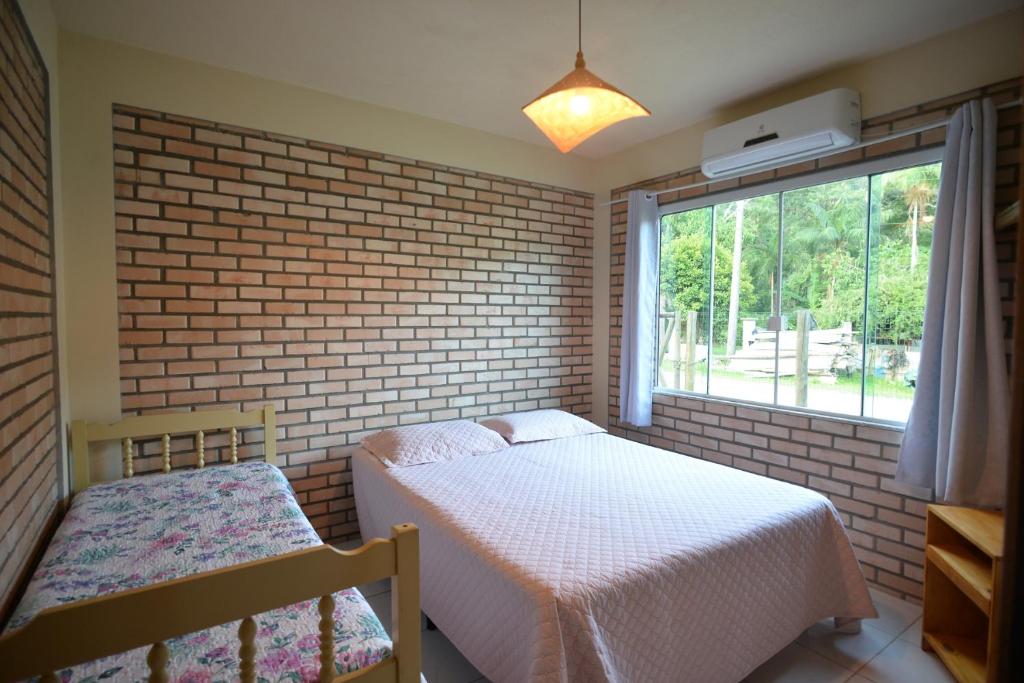 Cama ou camas em um quarto em Pousada Sítio Olho D'Água