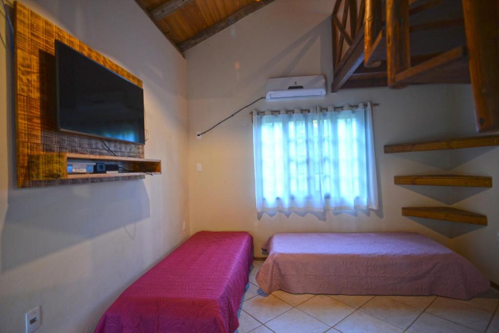 Cama ou camas em um quarto em Pousada Sítio Olho D'Água