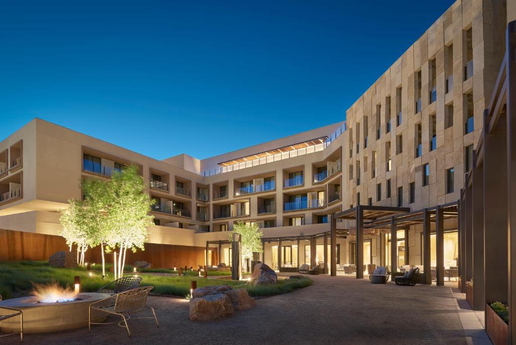 an exterior view of a building with a courtyard at Hotel Chaco in Albuquerque