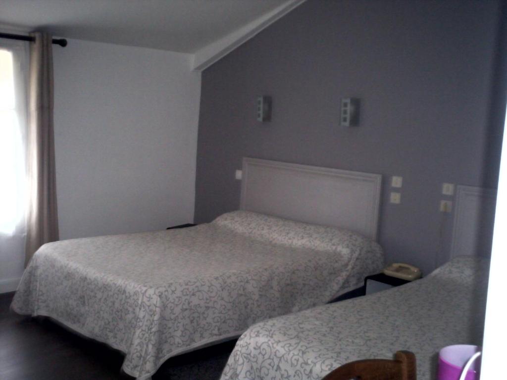 Postel nebo postele na pokoji v ubytování Le Ranfort Chambres d'Hôtes