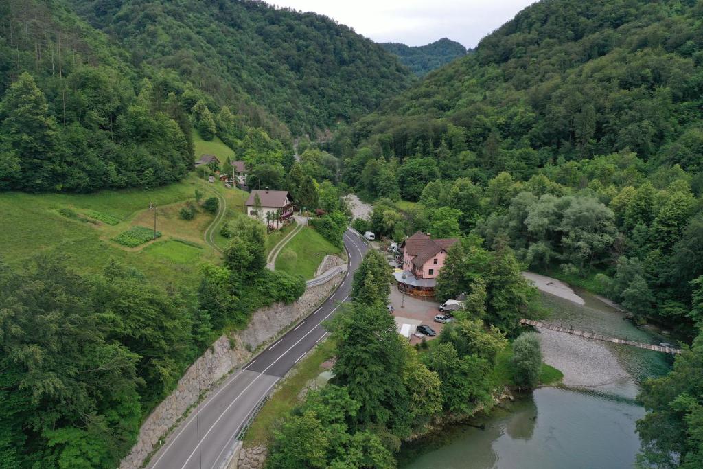 an aerial view of a road next to a river at Okrepčevalnica Kurn'k in Cerkno