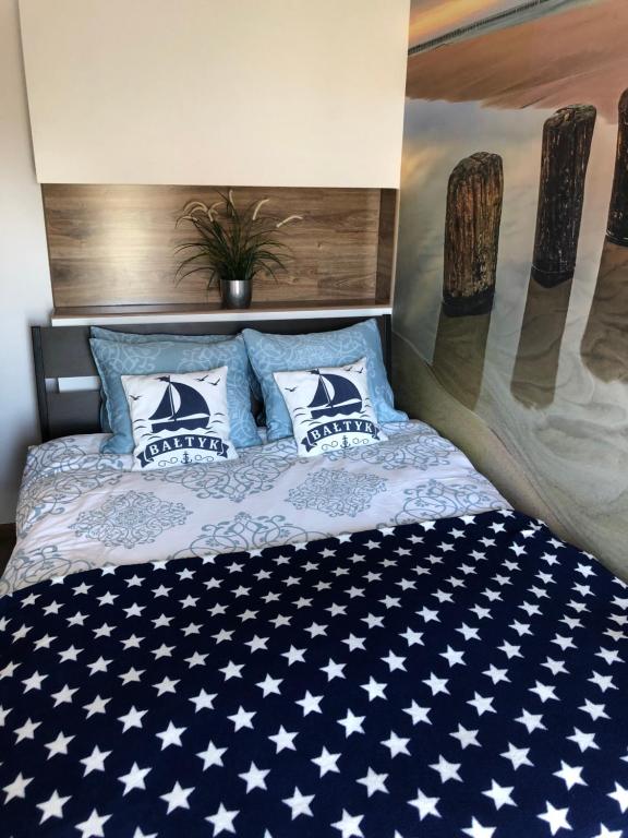 Posteľ alebo postele v izbe v ubytovaní Apartament Baltik Star