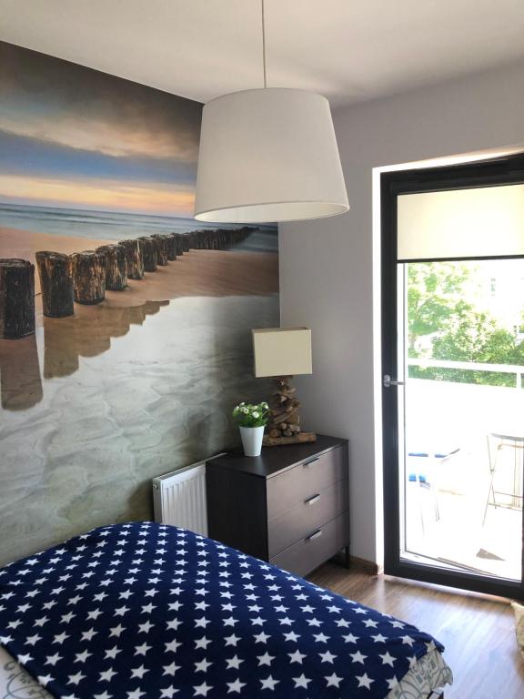 Posteľ alebo postele v izbe v ubytovaní Apartament Baltik Star