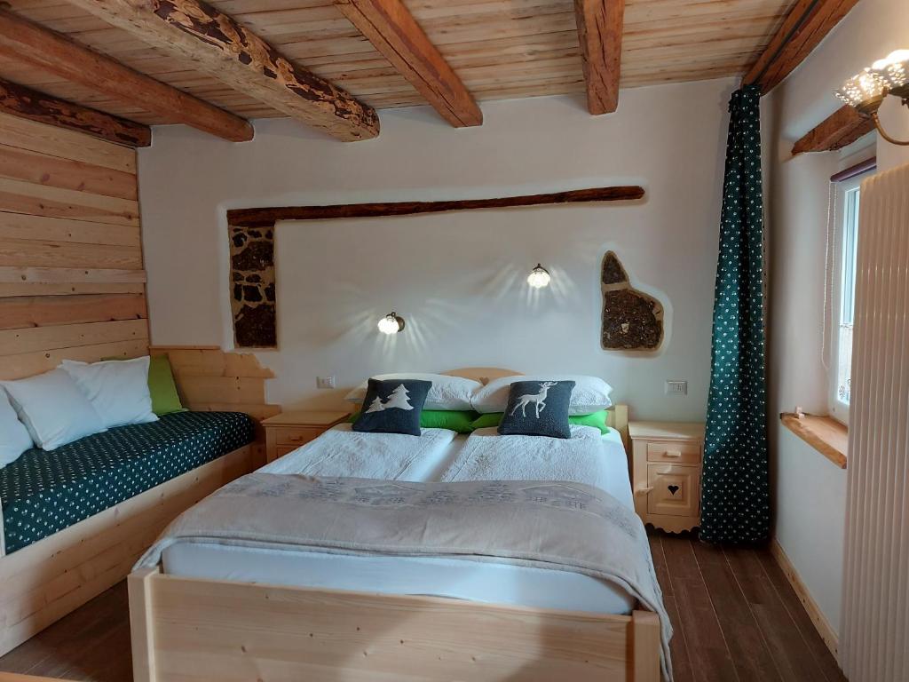 Postel nebo postele na pokoji v ubytování B&B SognoInCadore
