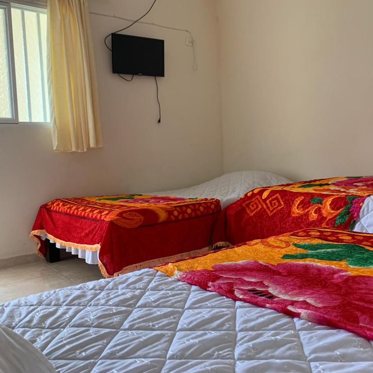 Postel nebo postele na pokoji v ubytování Hotel Maxim