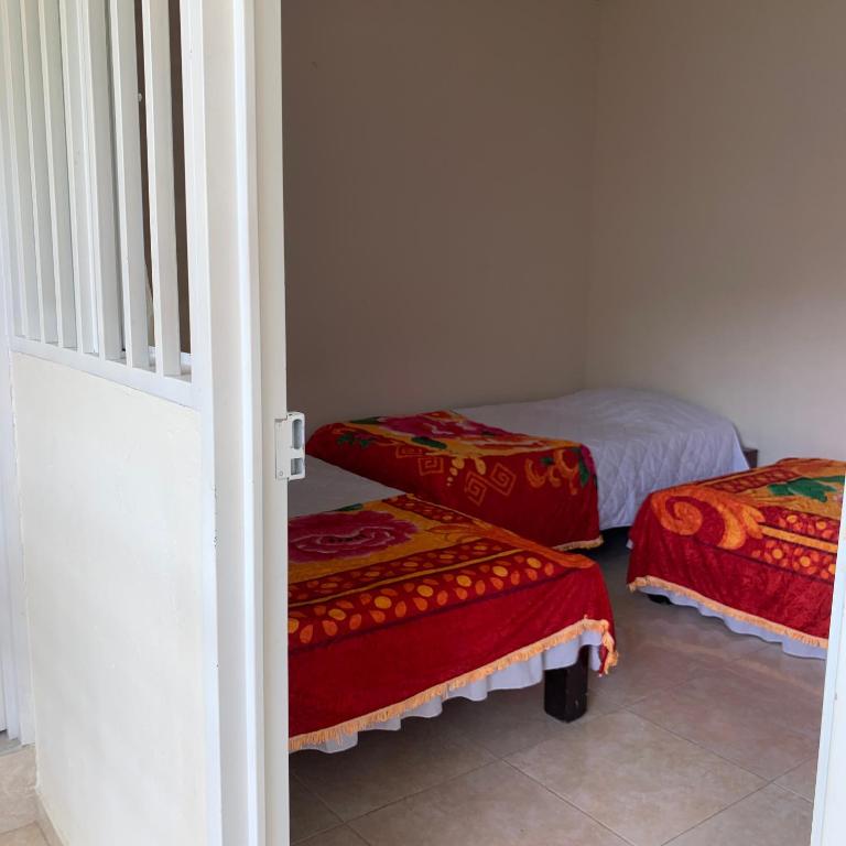 Postel nebo postele na pokoji v ubytování Hotel Maxim