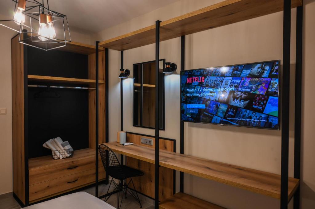 TV a/nebo společenská místnost v ubytování Hotel Hermes Pieria