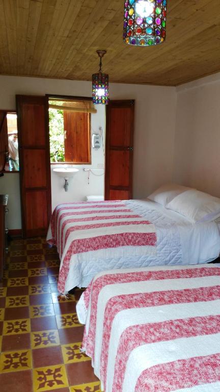 Postel nebo postele na pokoji v ubytování Hotel Kantarrana Urbana Jardin