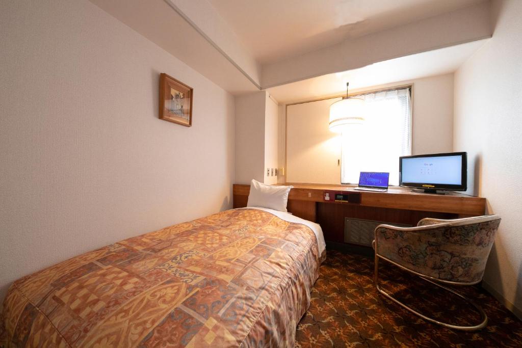 Postel nebo postele na pokoji v ubytování Hotel New Green