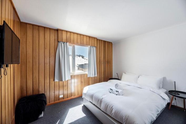 Postel nebo postele na pokoji v ubytování Eiger Chalet