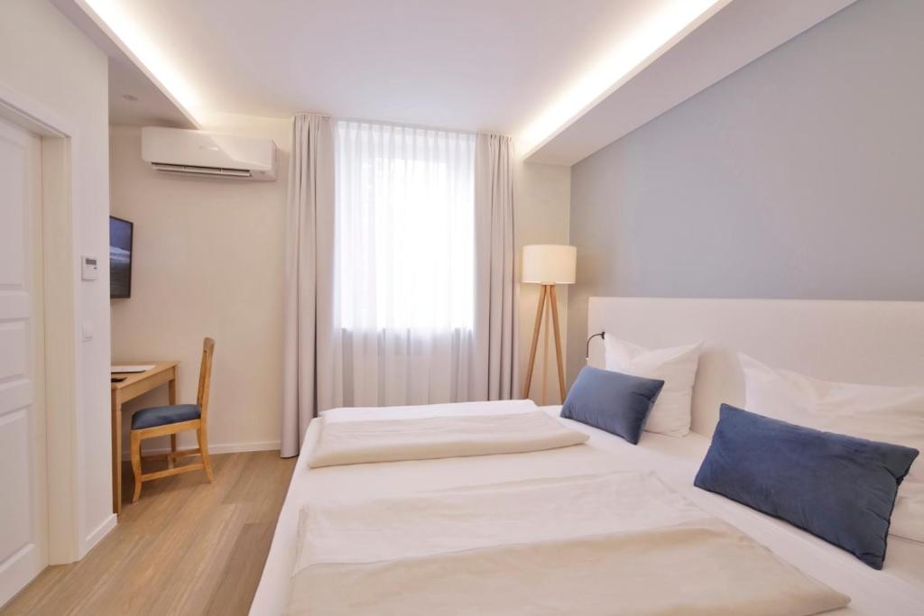 Postel nebo postele na pokoji v ubytování Landidyll Hotel Klostermühle
