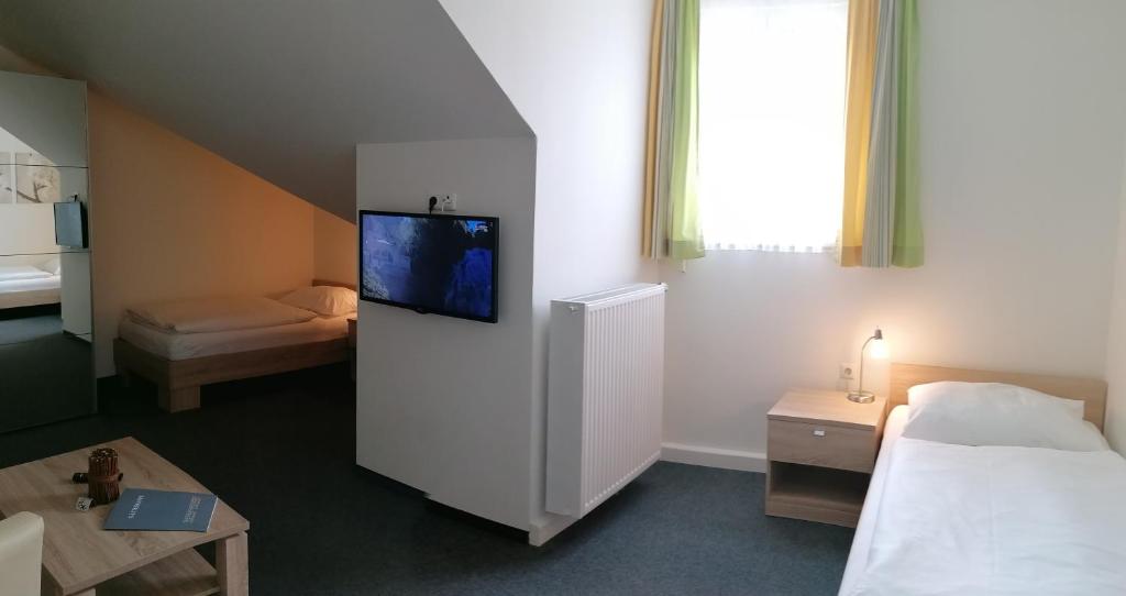 Posteľ alebo postele v izbe v ubytovaní Gästehaus Karl August