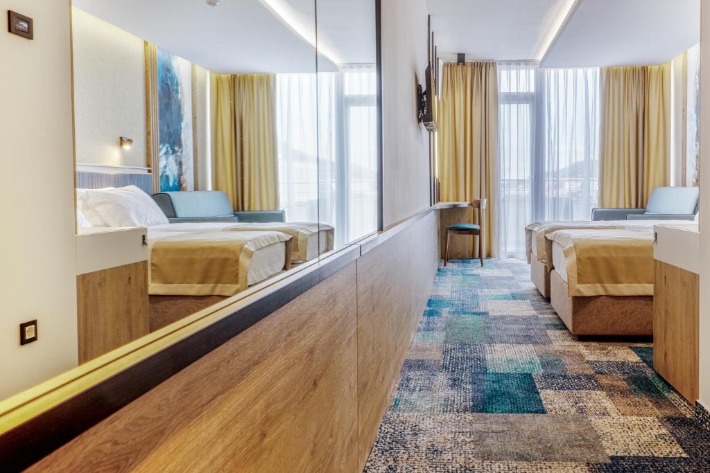 Postel nebo postele na pokoji v ubytování Hotel Sunce Neum