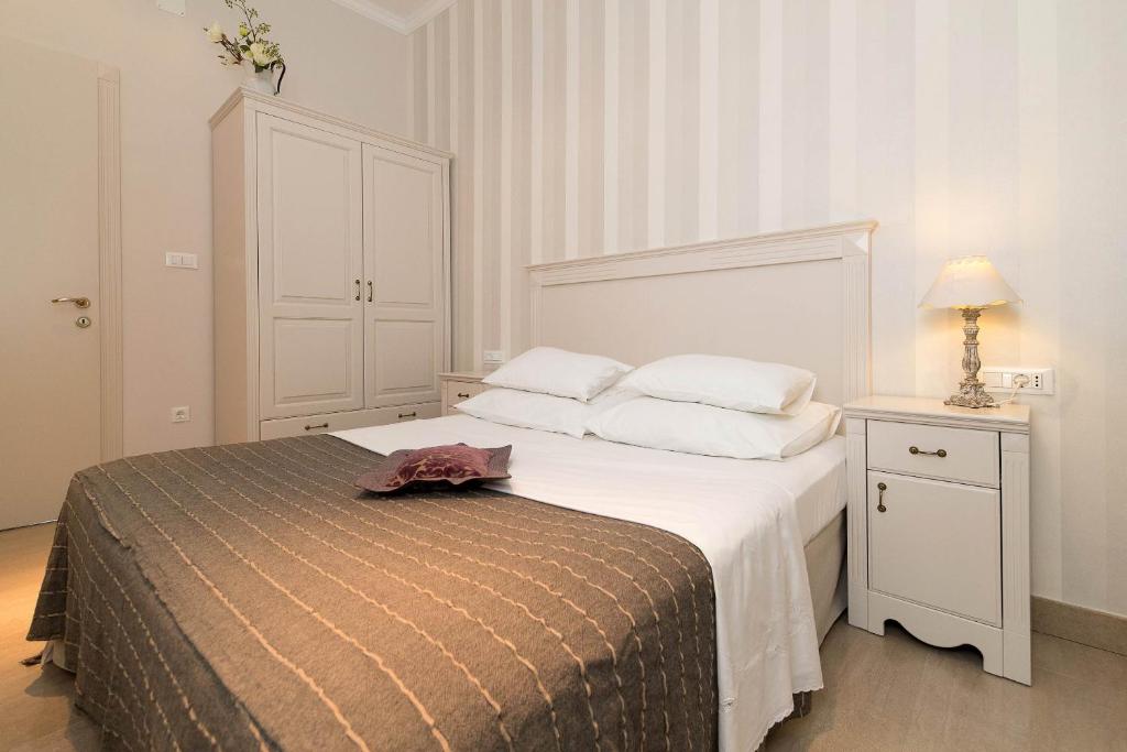 Posteľ alebo postele v izbe v ubytovaní Apartmani Marion Crikvenica