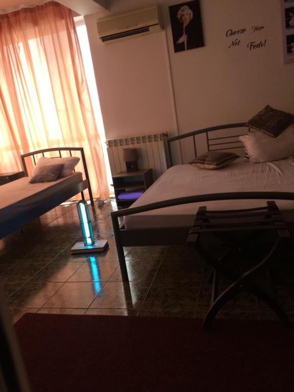 Postel nebo postele na pokoji v ubytování Studio Julius Constanta