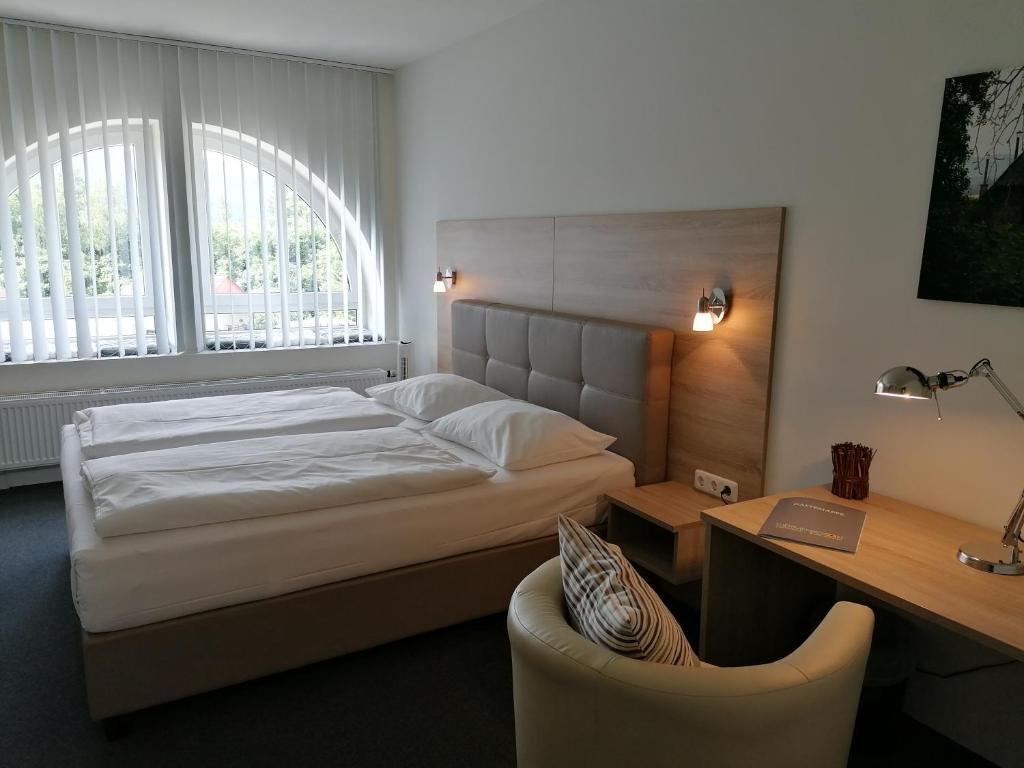 Posteľ alebo postele v izbe v ubytovaní Gästehaus Karl August