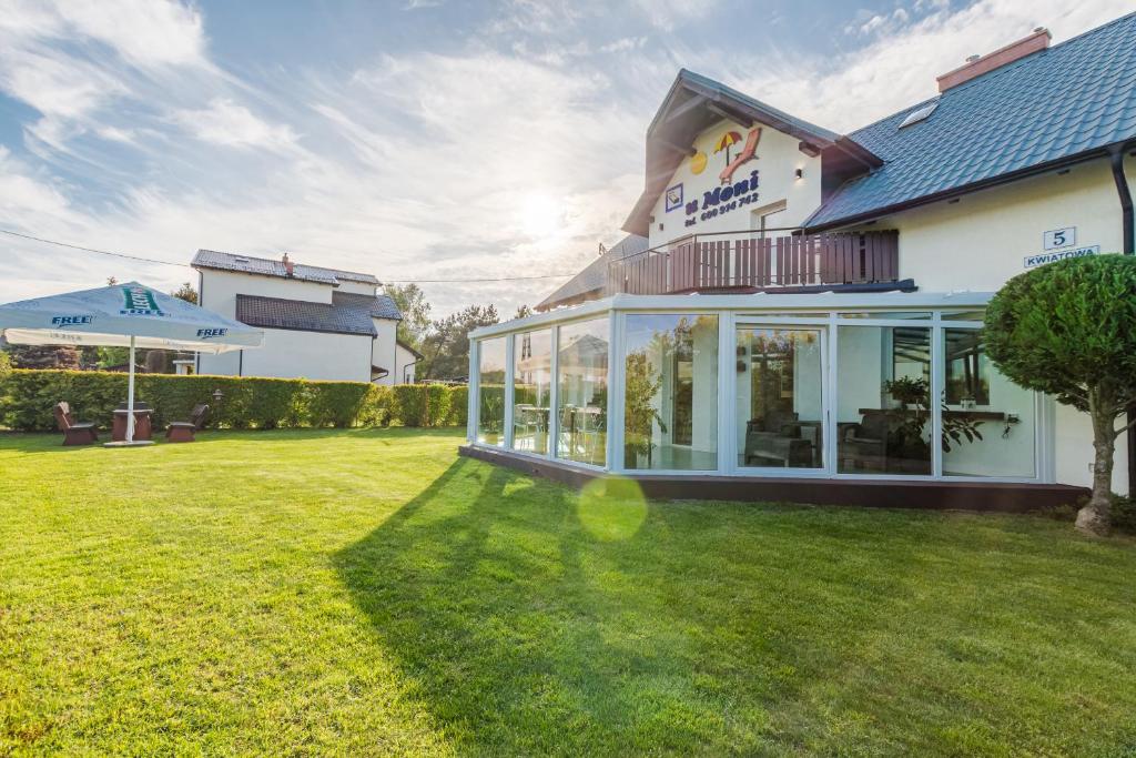 a house with a lawn in front of it at Morze u Moni in Karwieńskie Błoto Pierwsze
