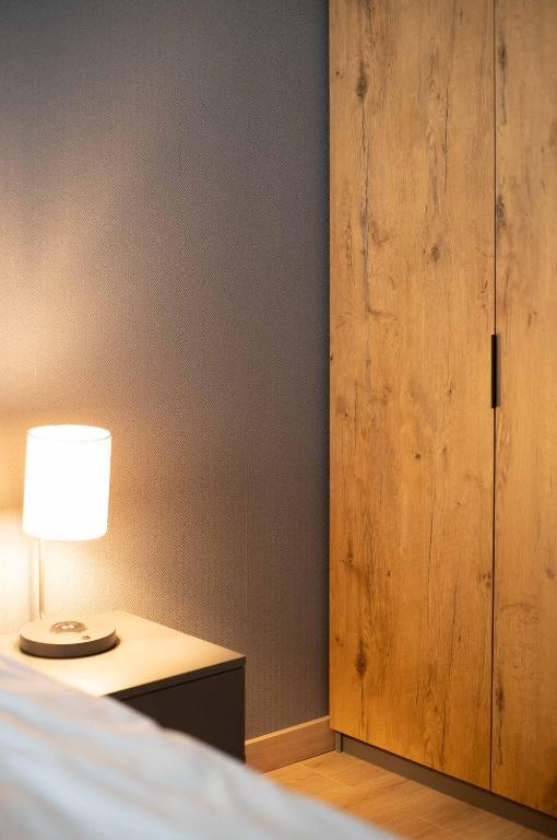 Posteľ alebo postele v izbe v ubytovaní 3D Spring Apartments Krakow
