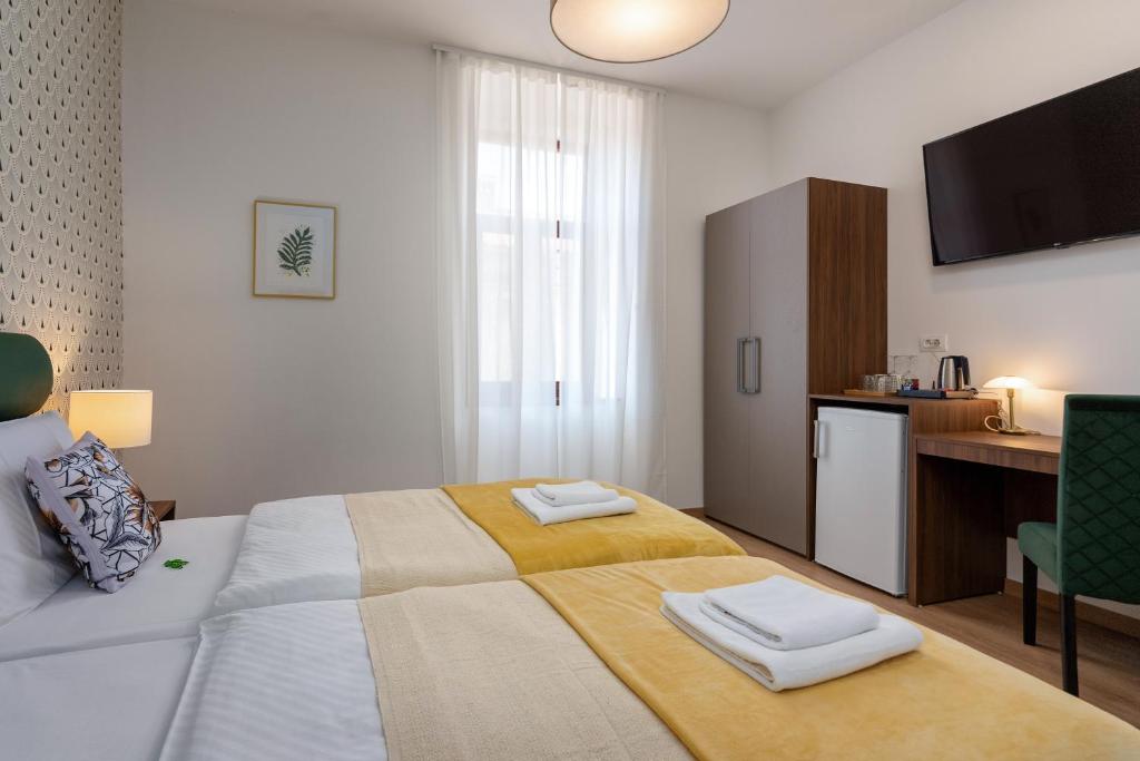 Postel nebo postele na pokoji v ubytování Aurora Rooms B&B Pula