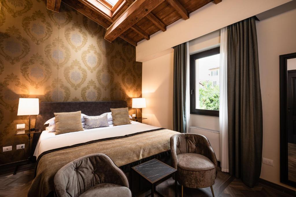 Katil atau katil-katil dalam bilik di Corte Guelfa