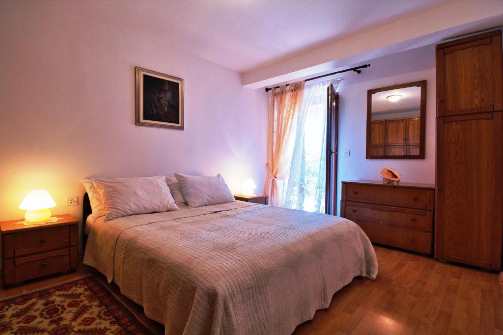 Postel nebo postele na pokoji v ubytování MONTE Beach Apartments