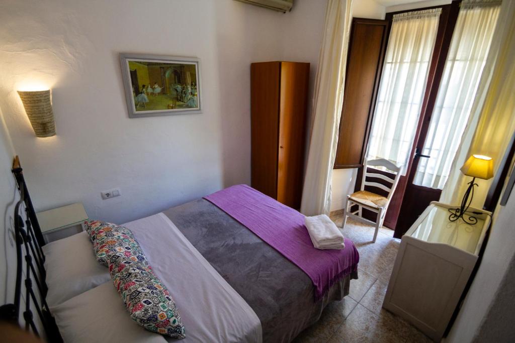 Cama o camas de una habitación en Pension el Portillo