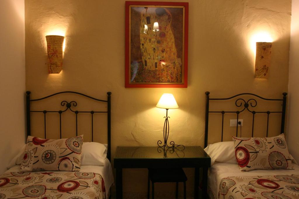 Cama o camas de una habitación en Pension el Portillo