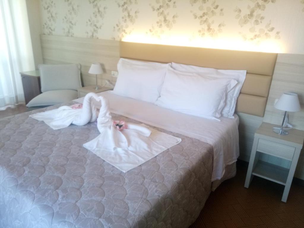 Postel nebo postele na pokoji v ubytování Hotel Welt