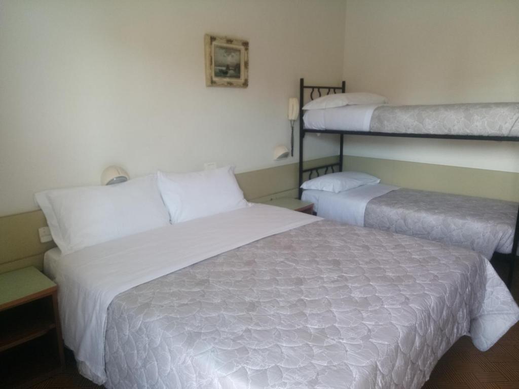 Postel nebo postele na pokoji v ubytování Hotel Welt