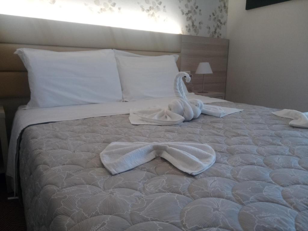Postel nebo postele na pokoji v ubytování Hotel Welt