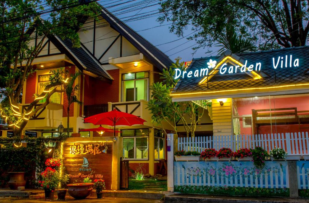 a dream garden villa with a sign in front of it at Dream Garden Villa Hotel Night Bazaar ChiangMai in Chiang Mai