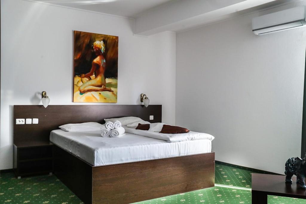 Uma cama ou camas num quarto em Hotel Pami