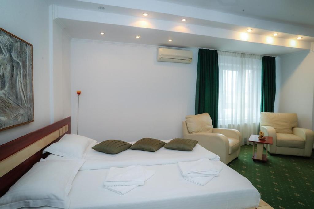 Uma cama ou camas num quarto em Hotel Pami