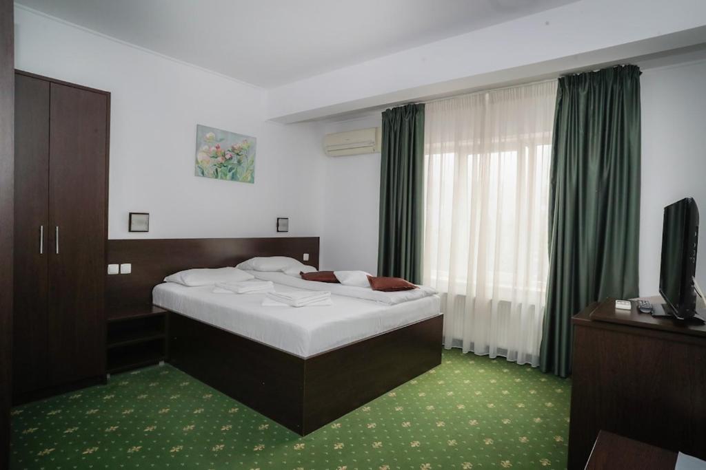 Uma cama ou camas num quarto em Hotel Pami