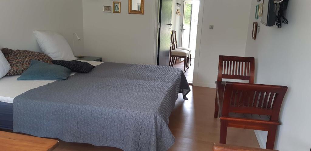 Postel nebo postele na pokoji v ubytování Karens Bakke 2