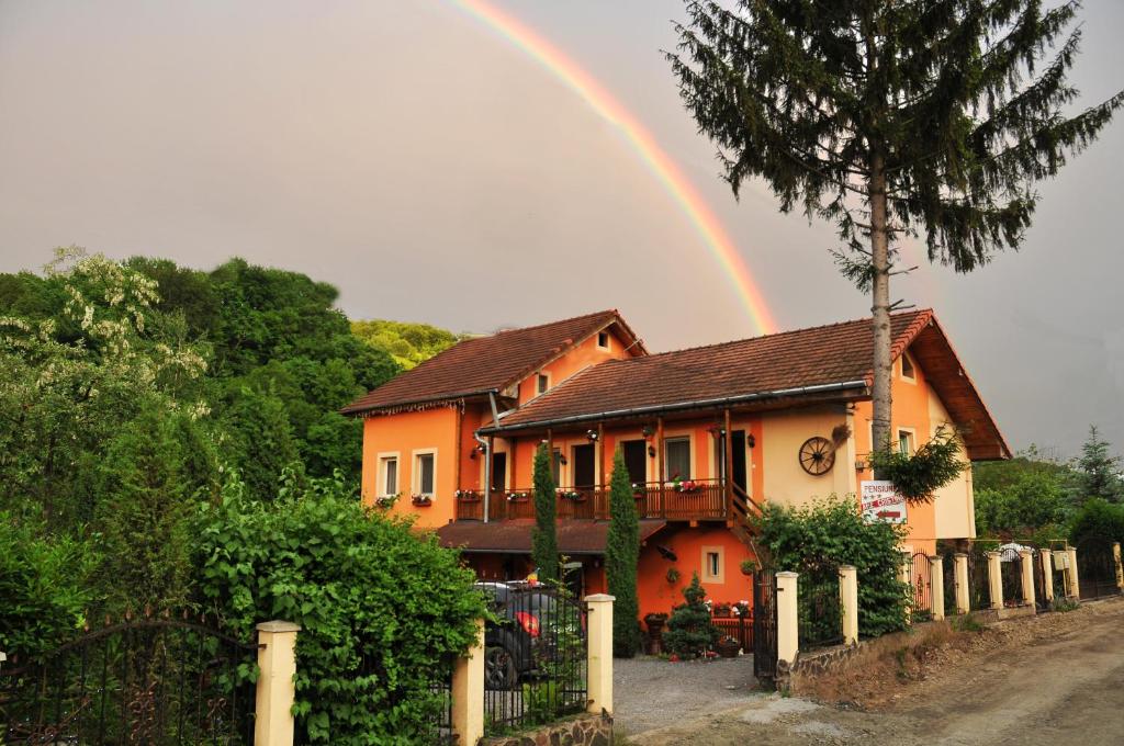 a rainbow over a house with at Pensiunea Ana Cristina in Sighişoara