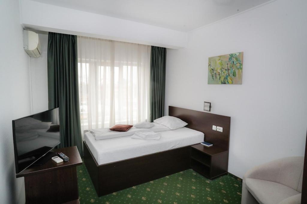 Uma cama ou camas num quarto em Hotel Pami