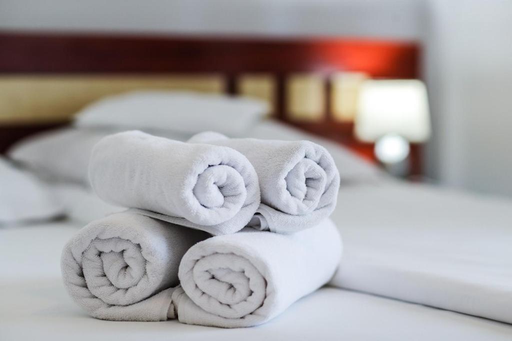 Uma cama ou camas num quarto em Hotel Pami