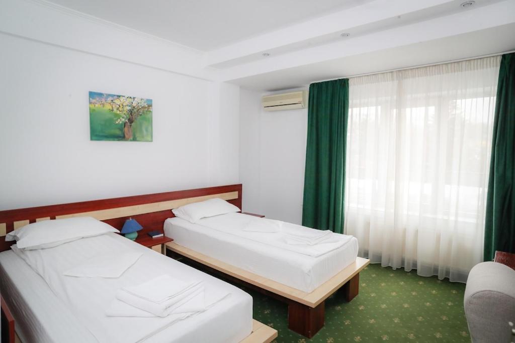 Uma cama ou camas num quarto em Hotel Pami