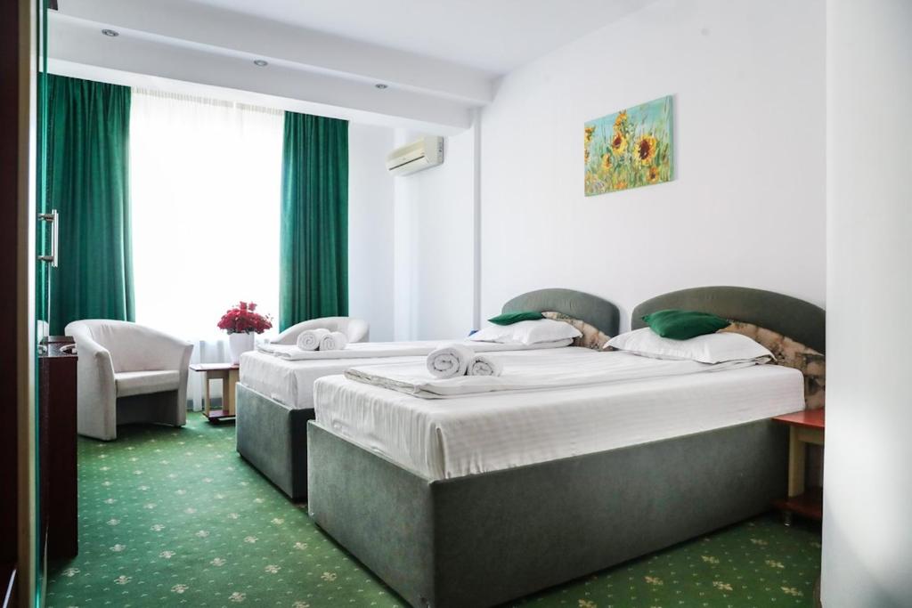 Uma cama ou camas num quarto em Hotel Pami