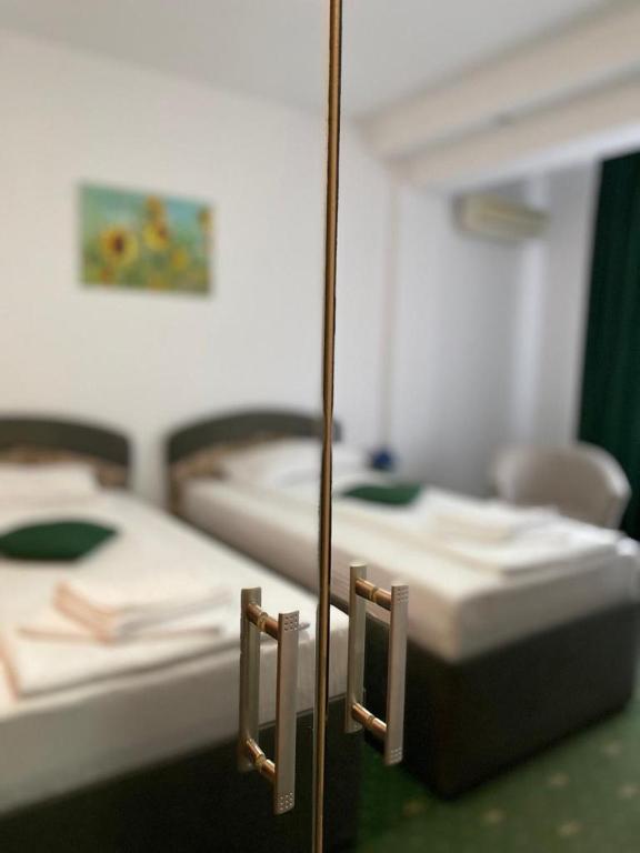 Uma cama ou camas num quarto em Hotel Pami