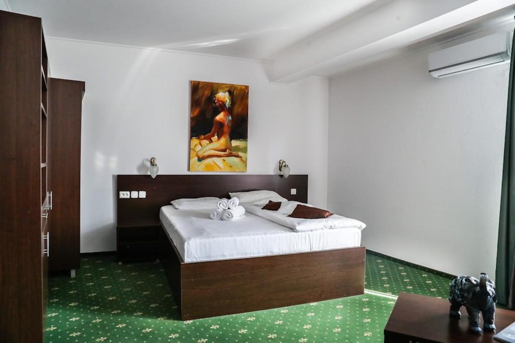 Uma cama ou camas num quarto em Hotel Pami
