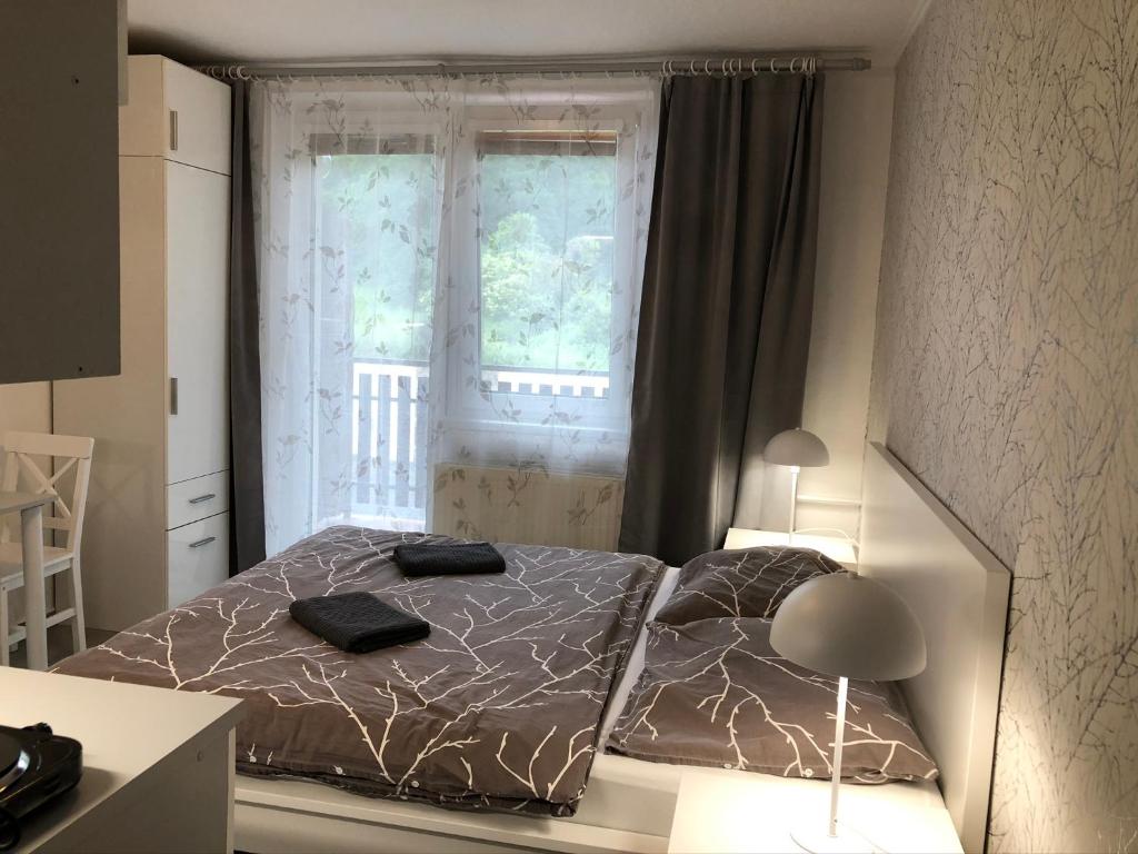 Postel nebo postele na pokoji v ubytování Penzion V Roklich & Apartmens V Roklich